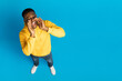 © Prostock-studio - Handsome black guy shouting towards copy space, high angle view