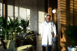Portrait of a male doctor stylish modern clinic lobby.