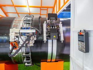 Poster - laser welding of pipeline. soldering robot on large diameter pipe. robotic pipe welder. automated we