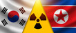 South Korea vs DPRK. Threat nuclear war. North Korea. Korean flags near nuclear danger symbol. Conflict between Asian states. Confrontation between two Koreans. South Korea. Flight conflict. 3d image