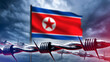 North Korean flag behind barbed wire. National symbol DPRC. Concept sanctions pressure on north Korea. Visa restrictions from DPRC. Migration policy of north Korea. Sanctions against Korea. 3d image