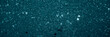 textured canvas of teal, with countless specks of white that resemble a blizzard or a flurry of stars in a teal night sky.