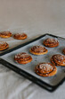 © Johnér - High angle view of baked cinnamon buns on baking tray