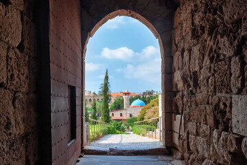 View from ancient crusader castle on the Sultan Abdul Majid Mosque in historical city of Byblos (Jbeil). Lebanon.