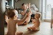 © Johnér - Father taking care of babies at home