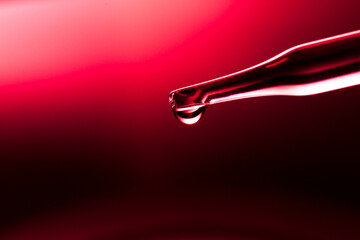 Wall Mural - row of test tubes, concept of medical or science laboratory, liquid droplets with droplets in red-bl