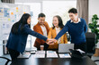 © Nuttapong punna - Asian hands of business people join together their hands together on unity concept