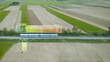 Electric locomotive sustainable train, remote battery charger control, futuristic smart society. Aerial view of public transportation in rural green field using green renewable energy