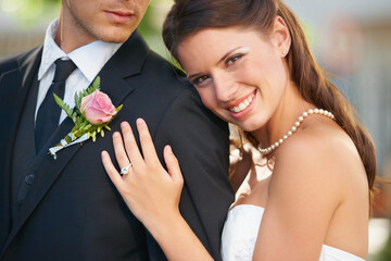 Poster - Bride woman, hug groom and portrait with smile, diamond ring and excited with love, care and fresh start. Couple, wedding and commitment to marriage in summer, outdoor and together for celebration