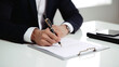 © Dilshad - Businessmen holding documents on a white table.