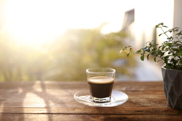 Wall Mural - coffee glass cup and diary notebooks and plant pot chill with sunshine