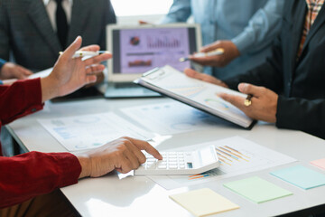 group businessmen and investors met together in conference room to view annual results their investments in business together in order to plan marketing doing business that would produce better result