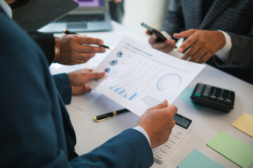 group businessmen and investors met together in conference room to view annual results their investments in business together in order to plan marketing doing business that would produce better result