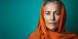 mature serious woman portrait orange shawl headscarf