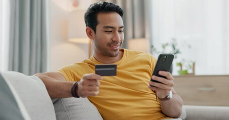 Poster - Man, credit card and phone for home online shopping, e commerce payment and subscription on sofa. Young, happy asian person relax on couch, mobile banking and loan application for streaming service