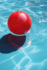Poster - A vibrant red ball floating peacefully in a pool of clear water. This image can be used to represent relaxation, playfulness, or even a summer pool party.