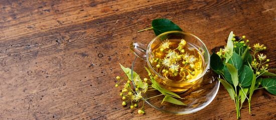 Sticker - linden tea on a wooden table