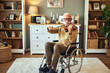 © Stockphotodirectors - Elderly man in the wheelchair playing the violin at home
