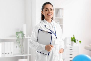 Wall Mural - Female physiotherapist with clipboard in rehabilitation center