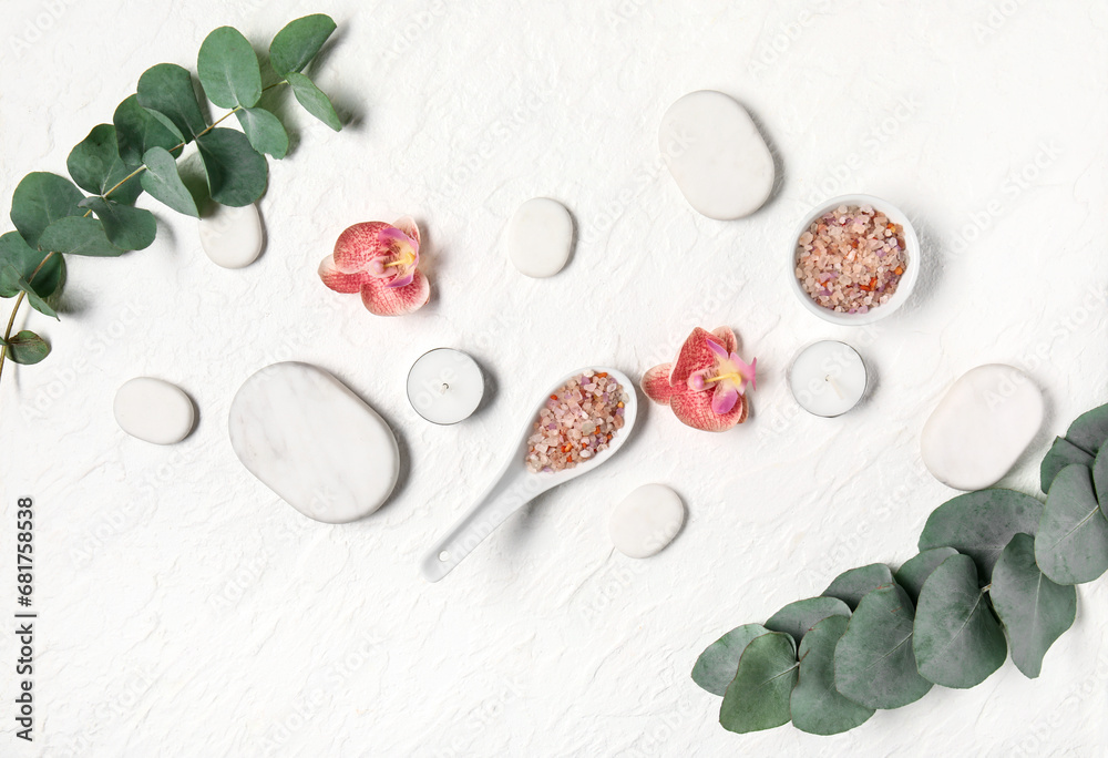 Composition with spa supplies and eucalyptus branches on light background