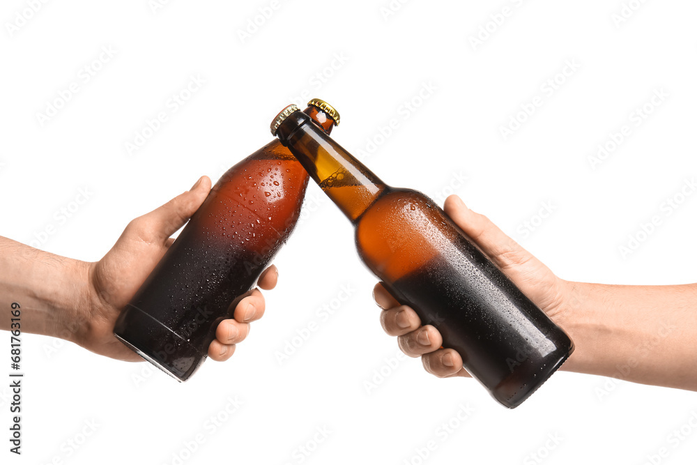 Women with bottles of cold beer on white background