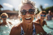 © Gonzalo - Happy woman in the pool during group classes. Aqua fit concept. Portrait with selective focus