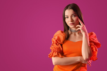 Poster - Stylish young woman on purple background