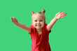 canvas print picture - Cute little girl opening arms for hug on green background