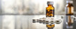 A pile of white pills on the table near jar or bottle of medicine. Side view with blurred background, copy space. Drug therapy concept.