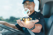 © Nuad Contributor - Professional truck driver's hand shows sign of the top service Quality assurance 5 star, Guarantee, Standards, ISO certification, and standardization concept. Transportation and delivery of products.