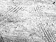 Original vector grunge texture of a lot of car tire prints on the sand. Distress texture for overlay, stencil. Design element. Rough abstract illustration with big and small grains dirt spray, damages
