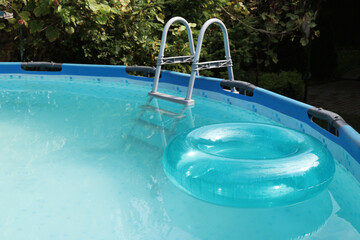 Sticker - Inflatable ring floating on water in above ground swimming pool outdoors