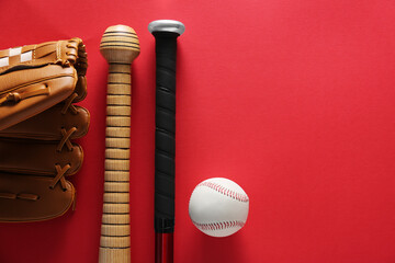 Baseball glove, bats, ball and batting helmet on red background, flat lay. Space for text