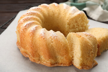 Delicious freshly baked sponge cake on table, closeup