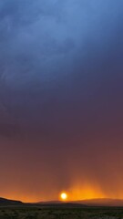 Wall Mural - Vertical Colorful sunset timelapse as storm rolls the through sky and sun dips below the horizon in the Utah desert.