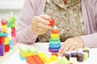 © manassanant - Asian elderly woman playing puzzles game for treatment dementia prevention and Alzheimer disease.