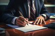 © duyina1990 - White Man Signing Documents at the Desk