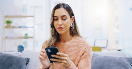 Woman, phone and home on living room sofa with reading, texting or typing for email, contact or web blog. Girl, smartphone and check notification for update, news or social media app on lounge couch