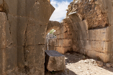 Wall Mural - A dilapidated  loophole in a room in a watchtower in the medieval fortress of Nimrod - Qalaat al-Subeiba, located near the border with Syria and Lebanon on the Golan Heights, in northern Israel