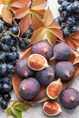 Wall Mural - Fresh ripe figs and dark grapes