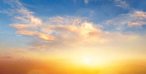 Wall Mural - sunrise and golden cloudy sky nature panorama background
