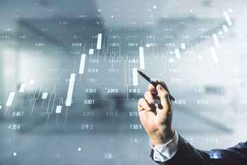 Fototapete - Man hand with pen working with abstract virtual analytics data spreadsheet on blurred office background, analytics and analysis concept. Multiexposure
