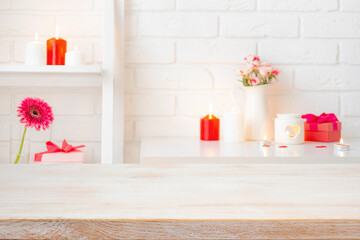 Wall Mural - valentines day background with wooden table top for product display over blurred love symbols compos