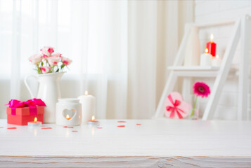 Wall Mural - empty wooden table for your product montage with blur decorated room interior background