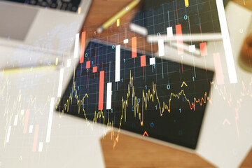 Poster - Multi exposure of abstract creative financial graph with world map and modern digital tablet on background, top view, forex and investment concept