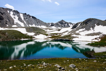 Beautiful blue mountain lakes at high altitude. 
Beautiful mountain landscapes. 
Valley of lakes in the Kensu gorge in Kazakhstan. Almaty region.
