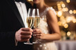 © Anastasiia - Newlywed Couple Holding Champagne Glasses In The Background Of Party