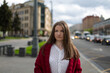 © Ann - Street portrait of a young woman dressed in a burgundy long cardigan, cute autumn outfit.