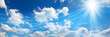 Heaven of blue sky, sun and clouds. Panoramic banner. Copy space where you can easily insert text such as advertisements.