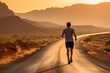 Outdoors lifestyle runners. Man running in nature from behind in desert.